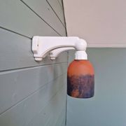 Pair of Art Deco wall sconces in multicoloured porcelain and frosted glass.