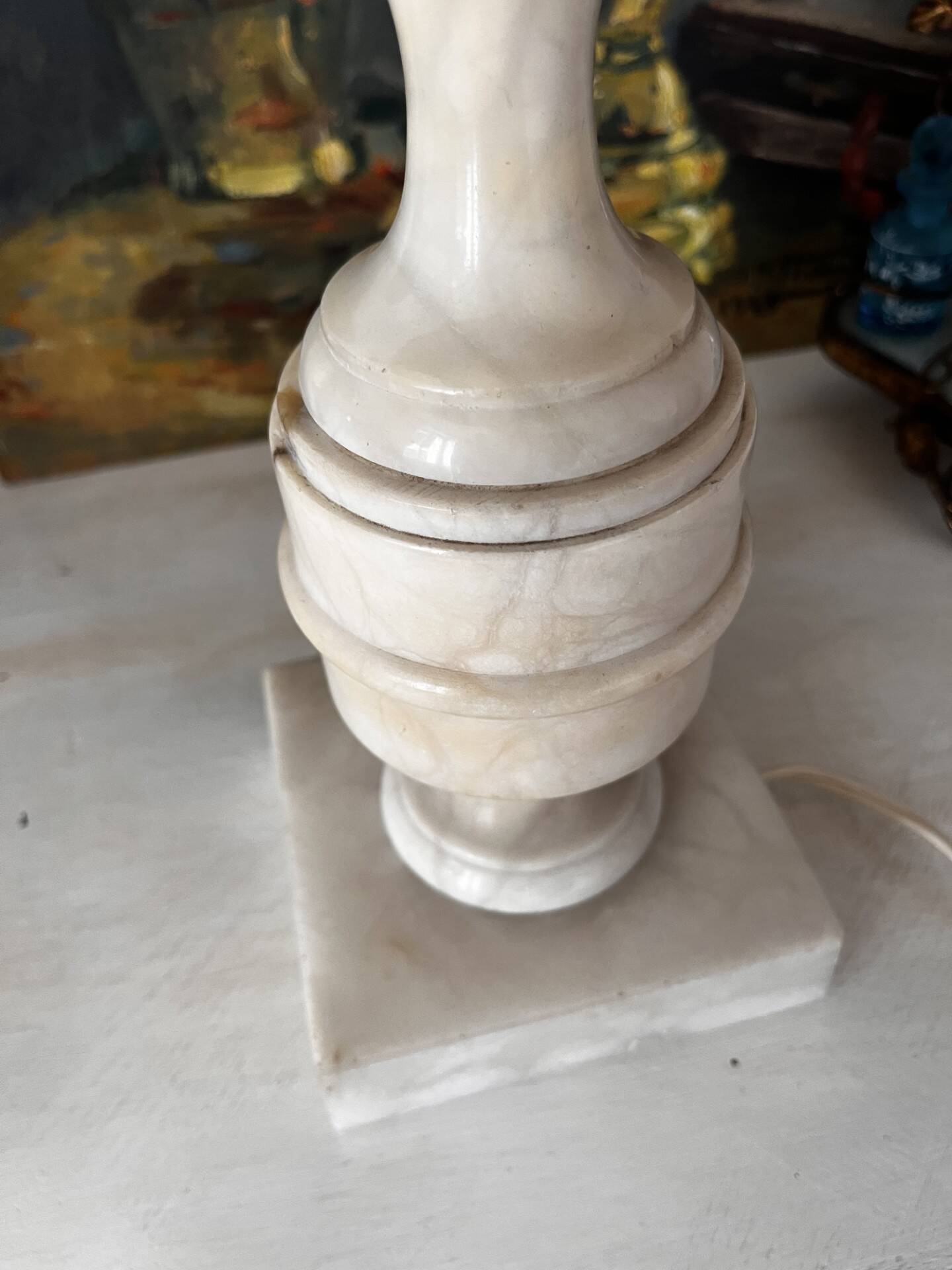 Antique lamp with a marble base.