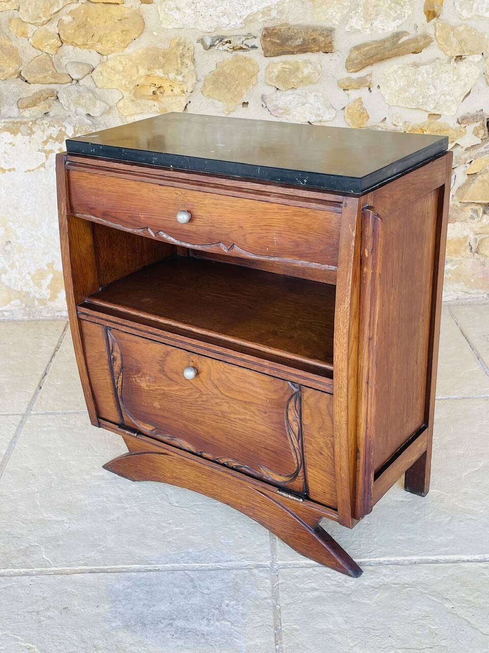 Art Deco bedside table in walnut, black marble top, circa 1920.