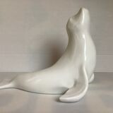 White earthenware sea lion in piggy bank