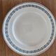 Old green-blue faience plates and dishes with geometric patterns.