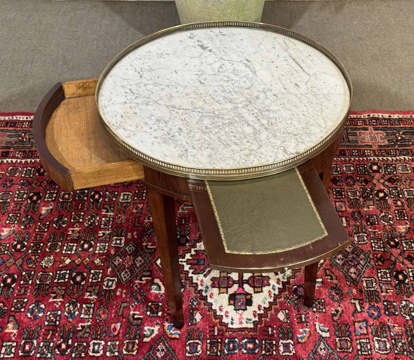 Louis XVI style bouillotte table in mahogany with a white marble top.