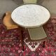 Louis XVI style bouillotte table in mahogany with a white marble top.