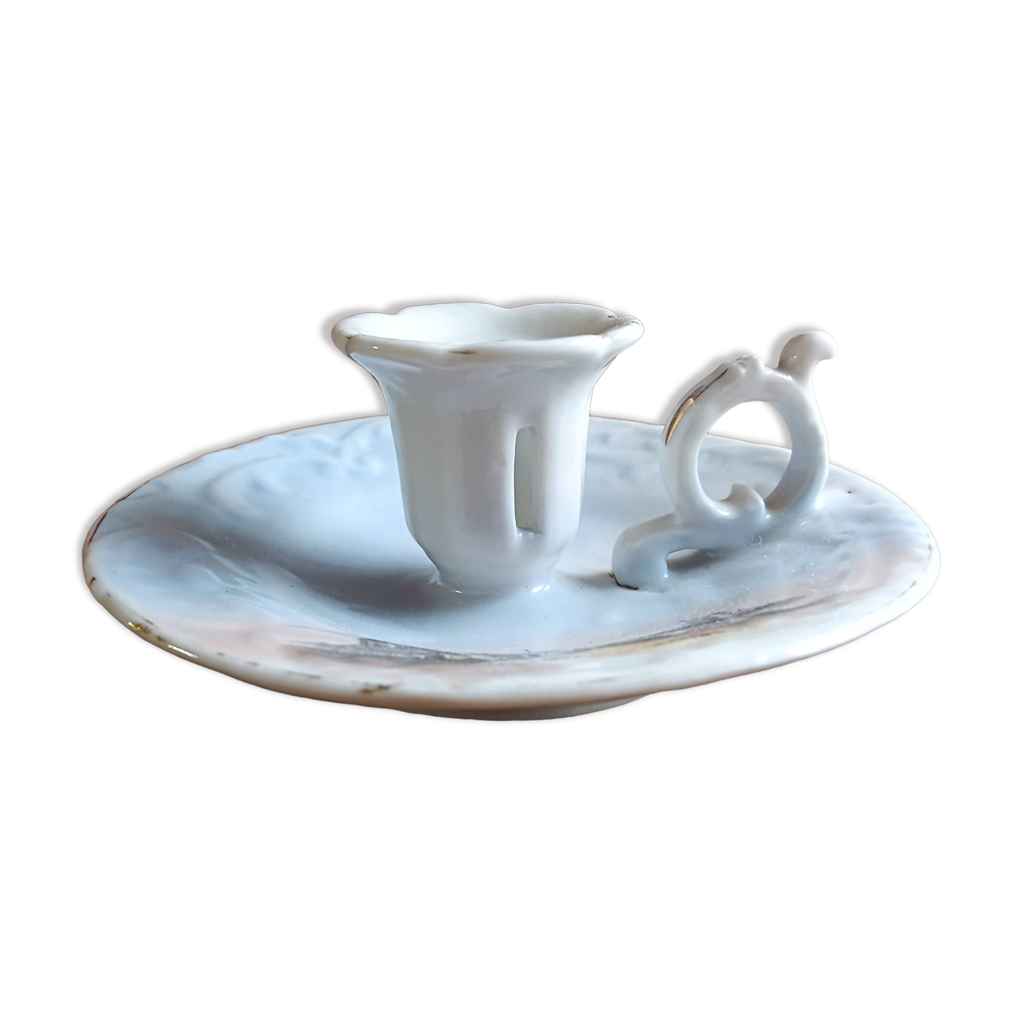 Antique handheld candle holder in porcelain