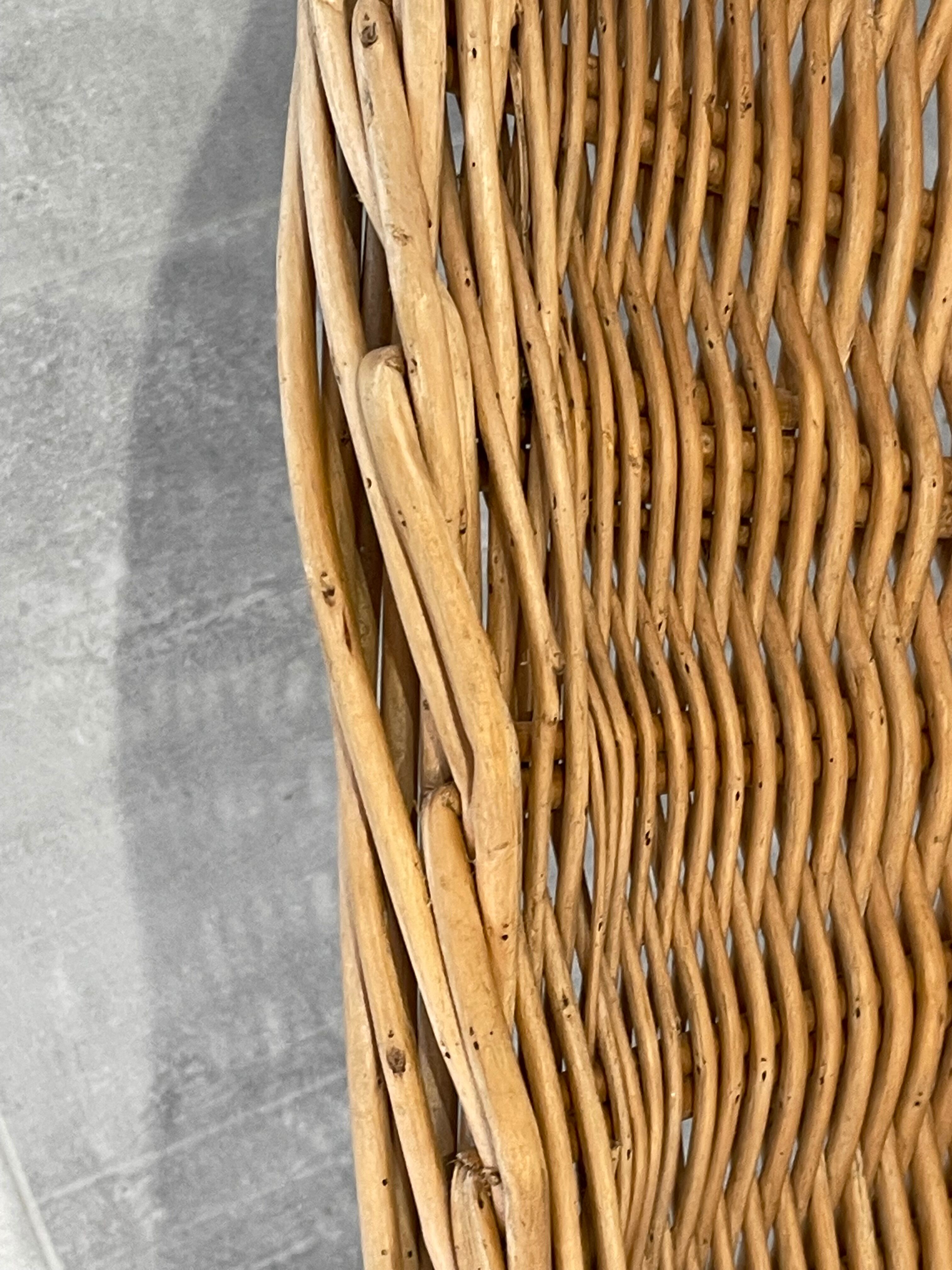 Pair of rattan and black metal armchairs, 1950s/60s