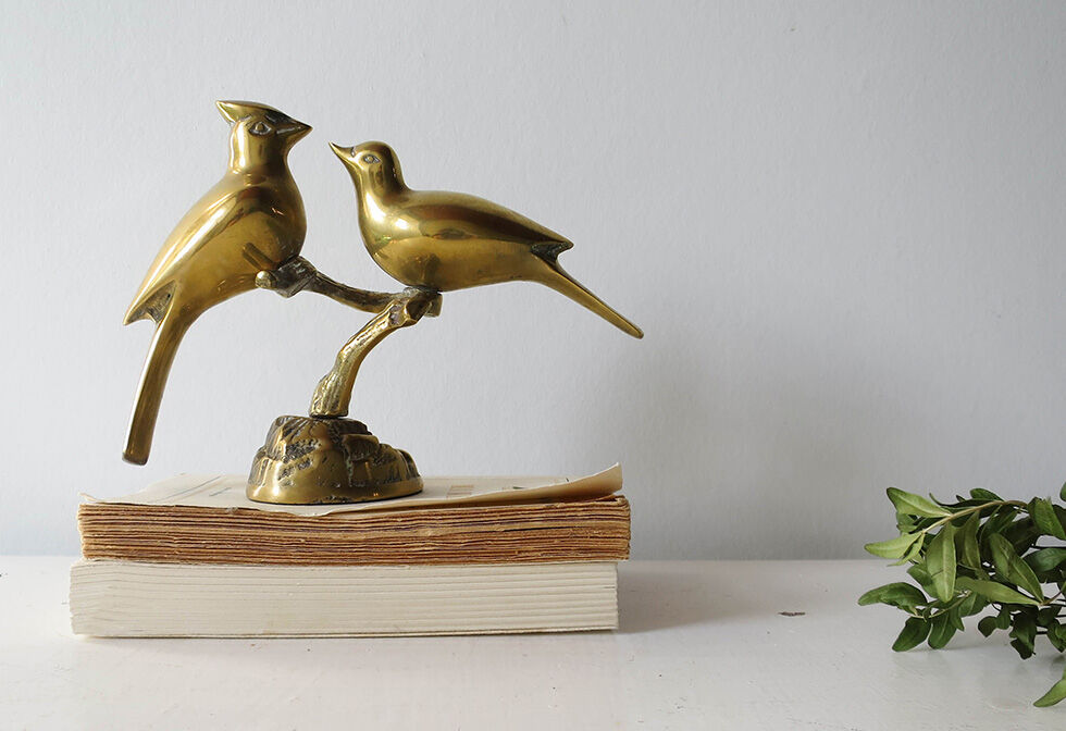 Couple brass birds