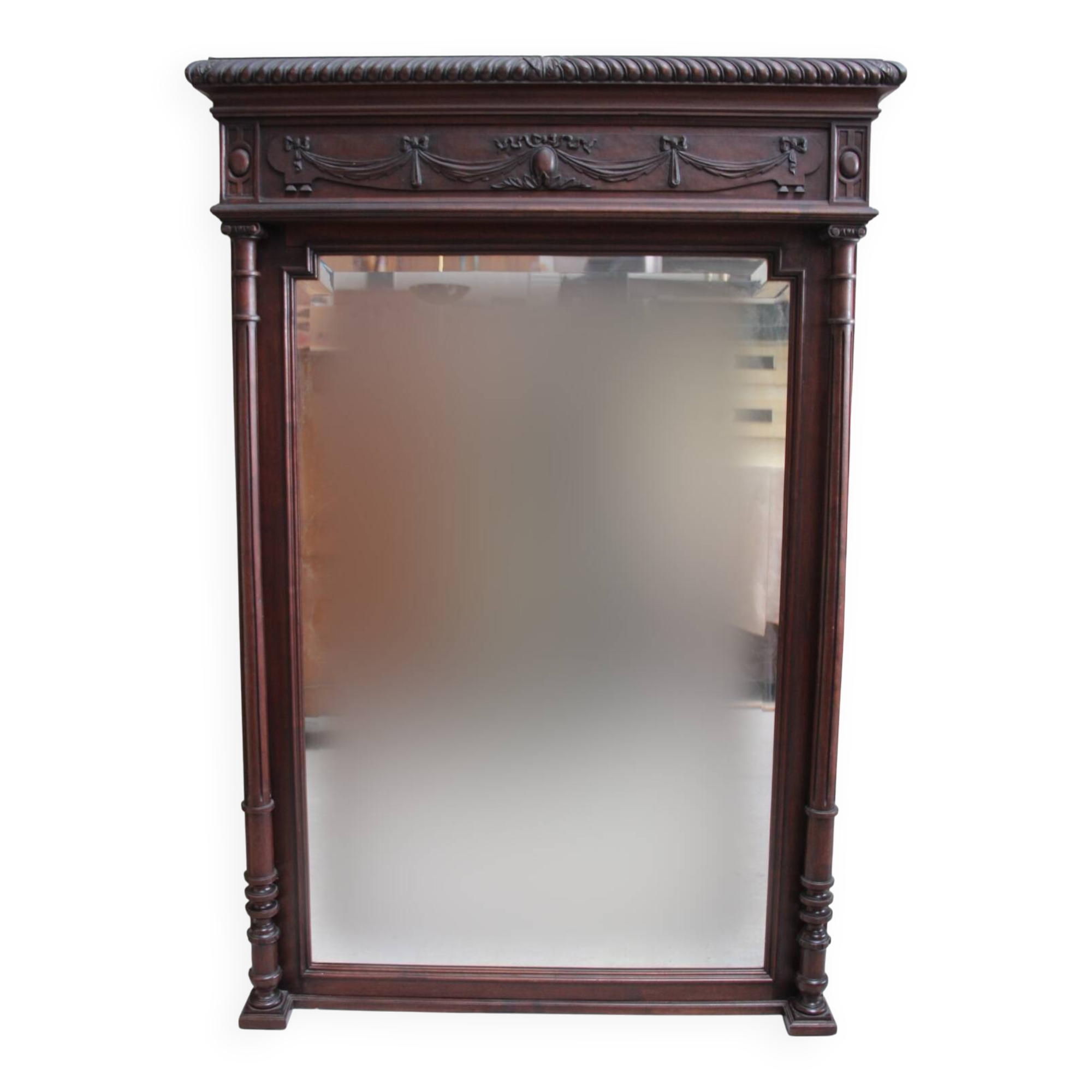 Imposing beveled mirror with wooden frame
