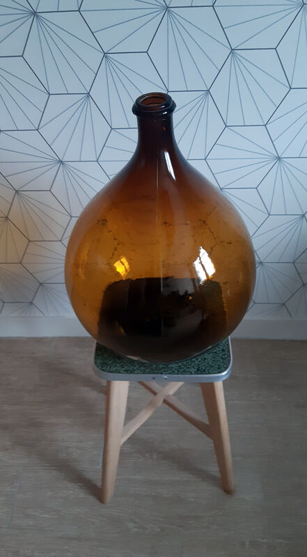 Great old demijohn in amber glass