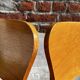 Set of 4 vintage bistro chairs in wood and red faux leather, with splayed legs.
