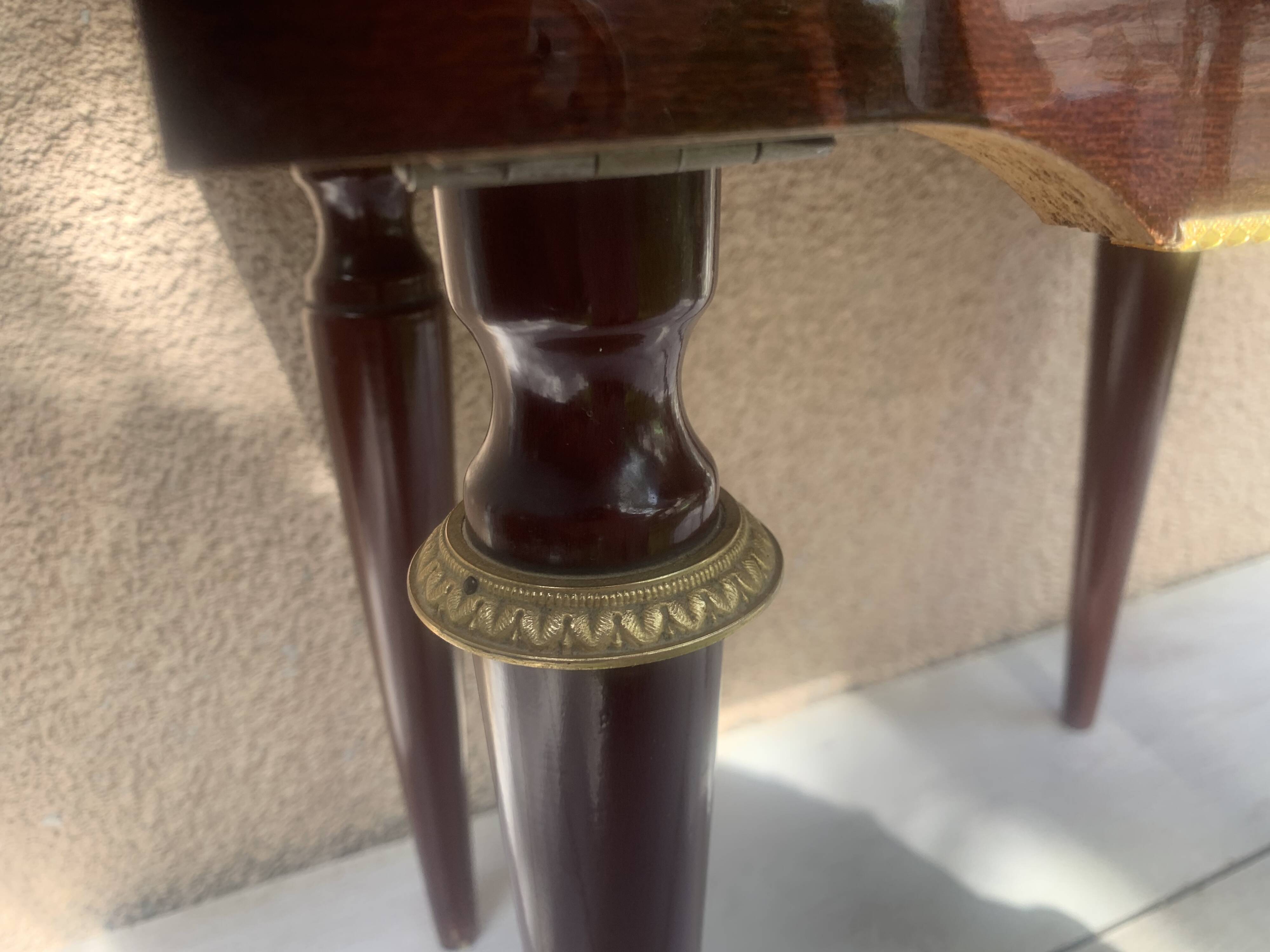Nightstand with lovely mid-century style gold metal decor.