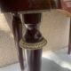 Nightstand with lovely mid-century style gold metal decor.
