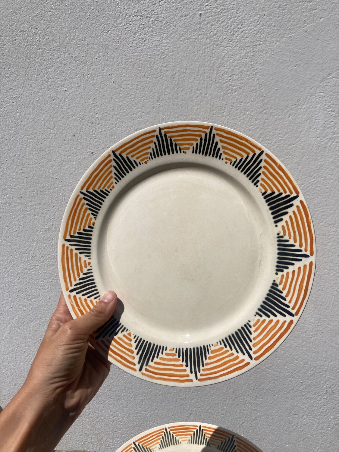 12 flat plates in yellow earthenware Badonviller
