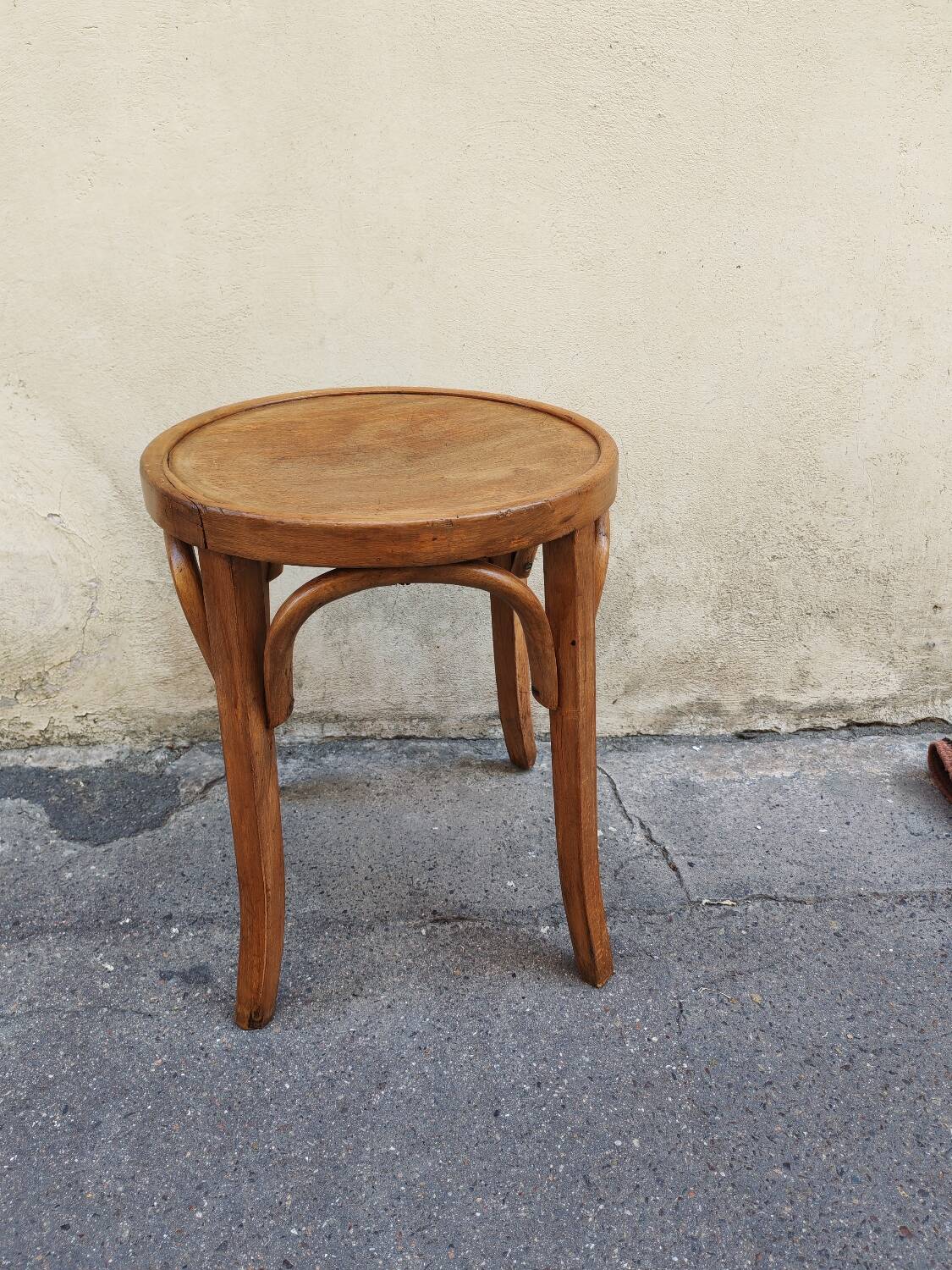 Curved wooden stool