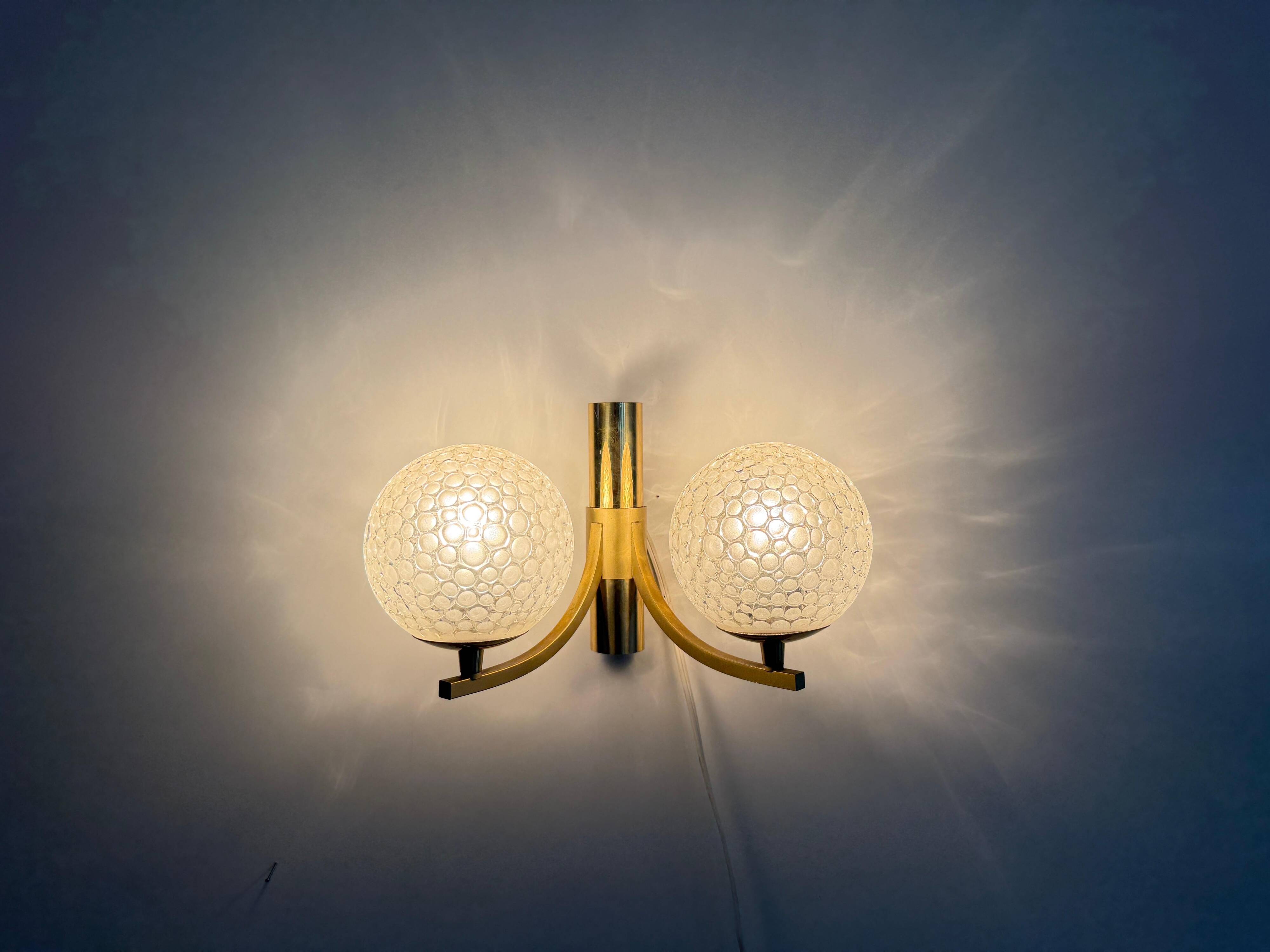 Simple two-armed wall light in brass and glass by Ball and Ball, Kaiser, 1960s, Germany.