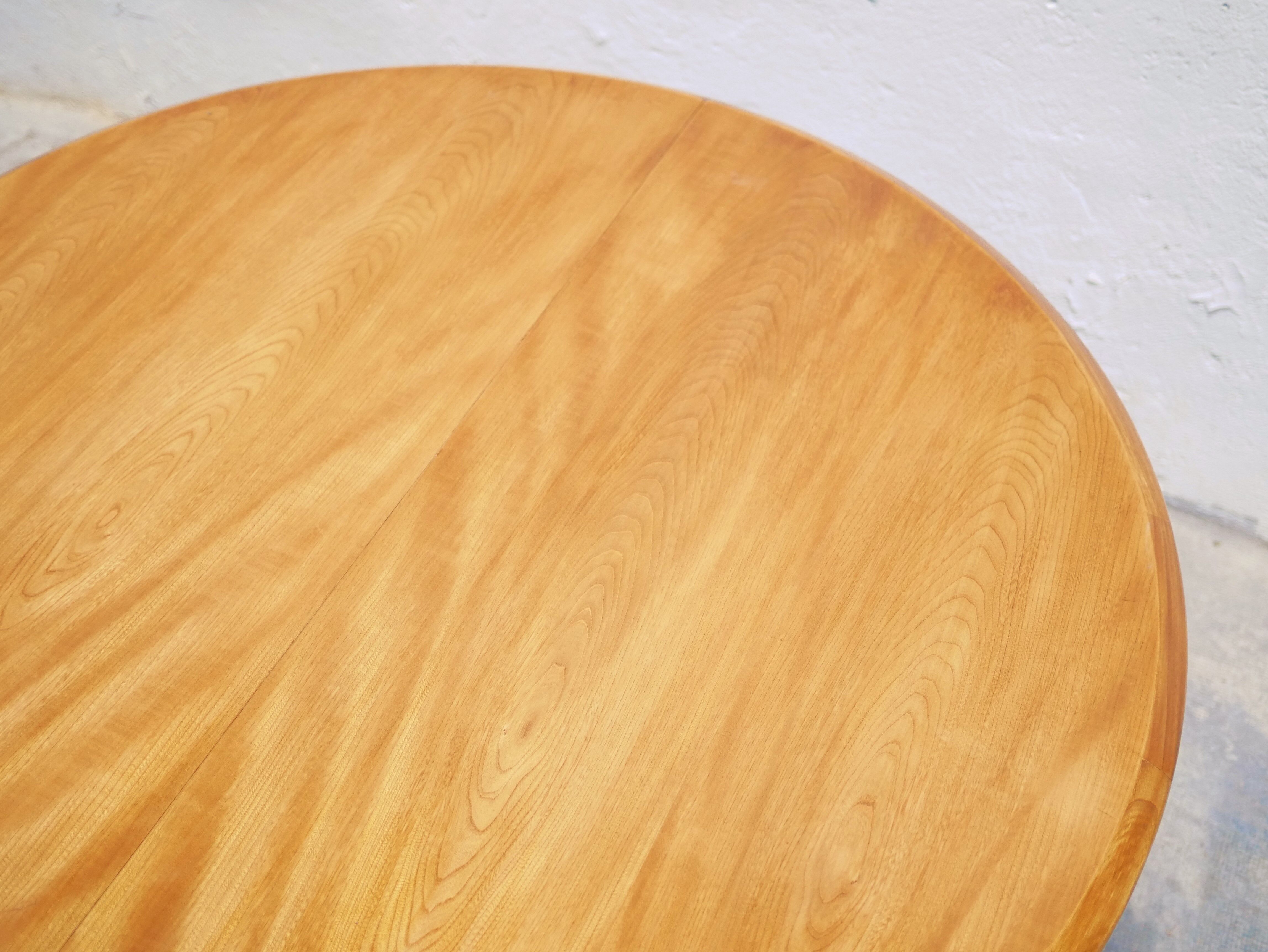 Vintage extendable round wooden dining table