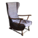 Vintage brown wooden rocking chair from the 1950s, wingback backrest and rocking base.