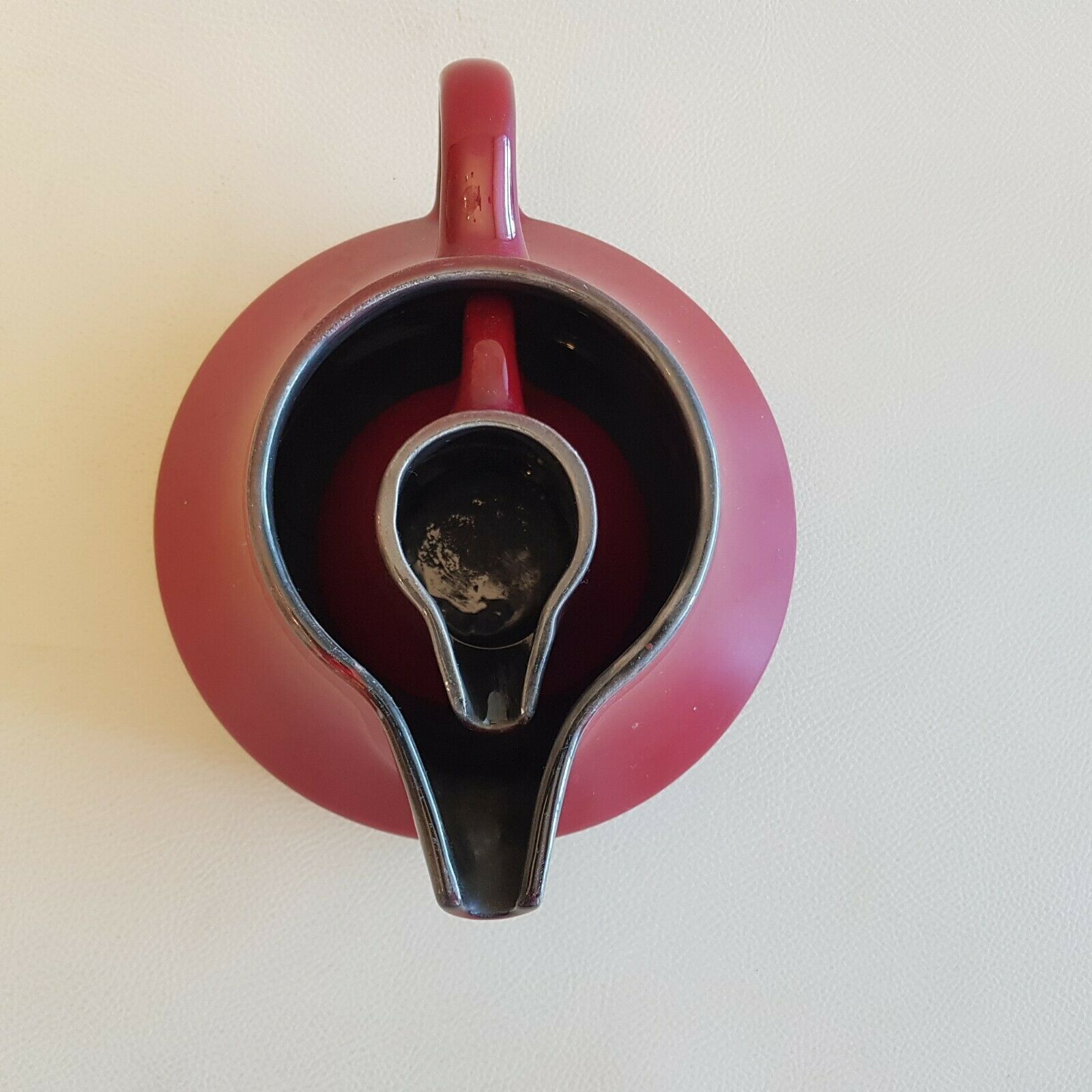 Teapot and milk jar in burgundy red ceramic