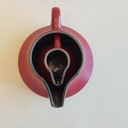 Teapot and milk jar in burgundy red ceramic