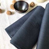 Lot four damasked and monogrammed towels linen and night blue silk