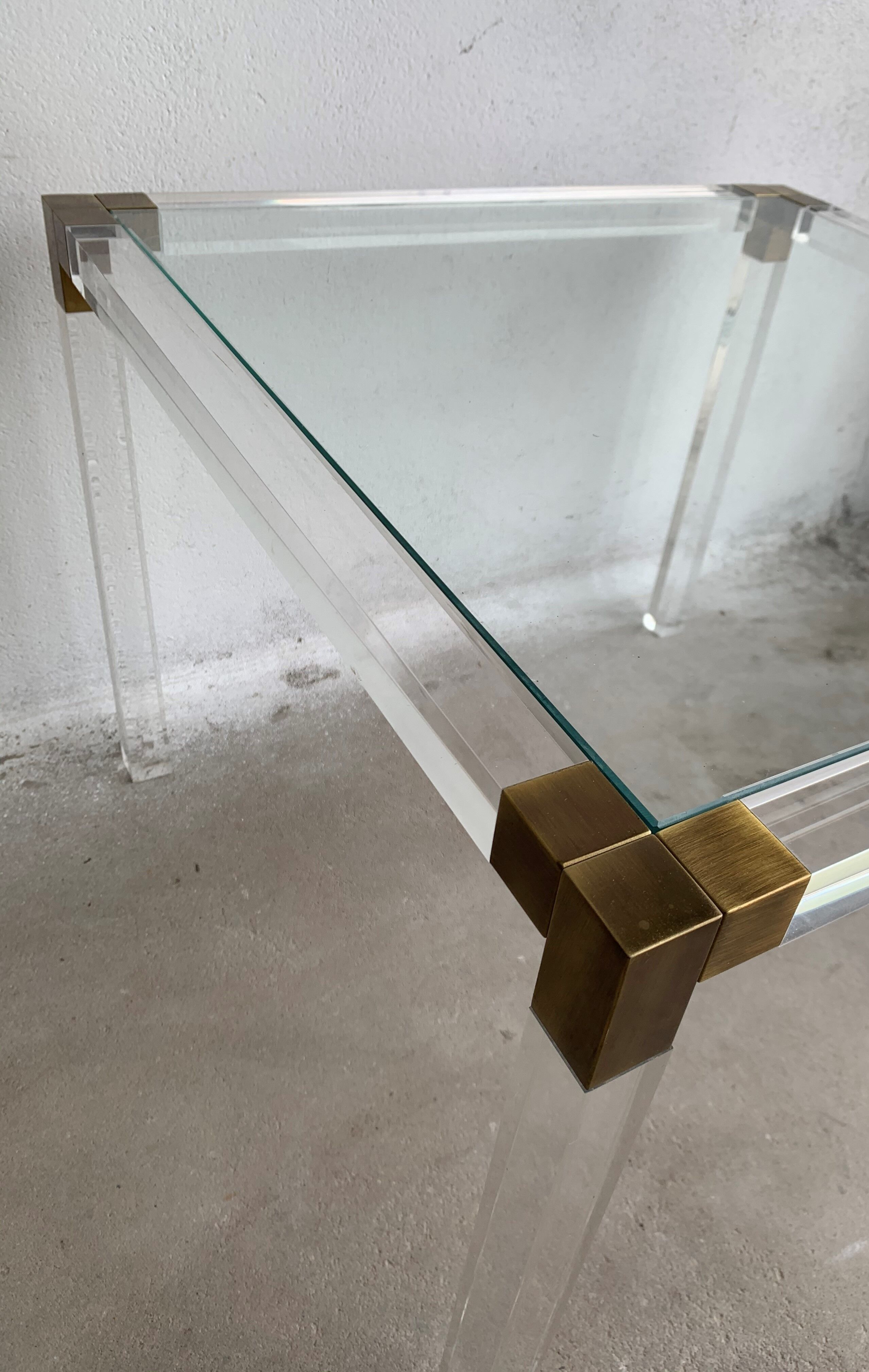 Lucite and brass coffee table by Charles Hollis Jones
