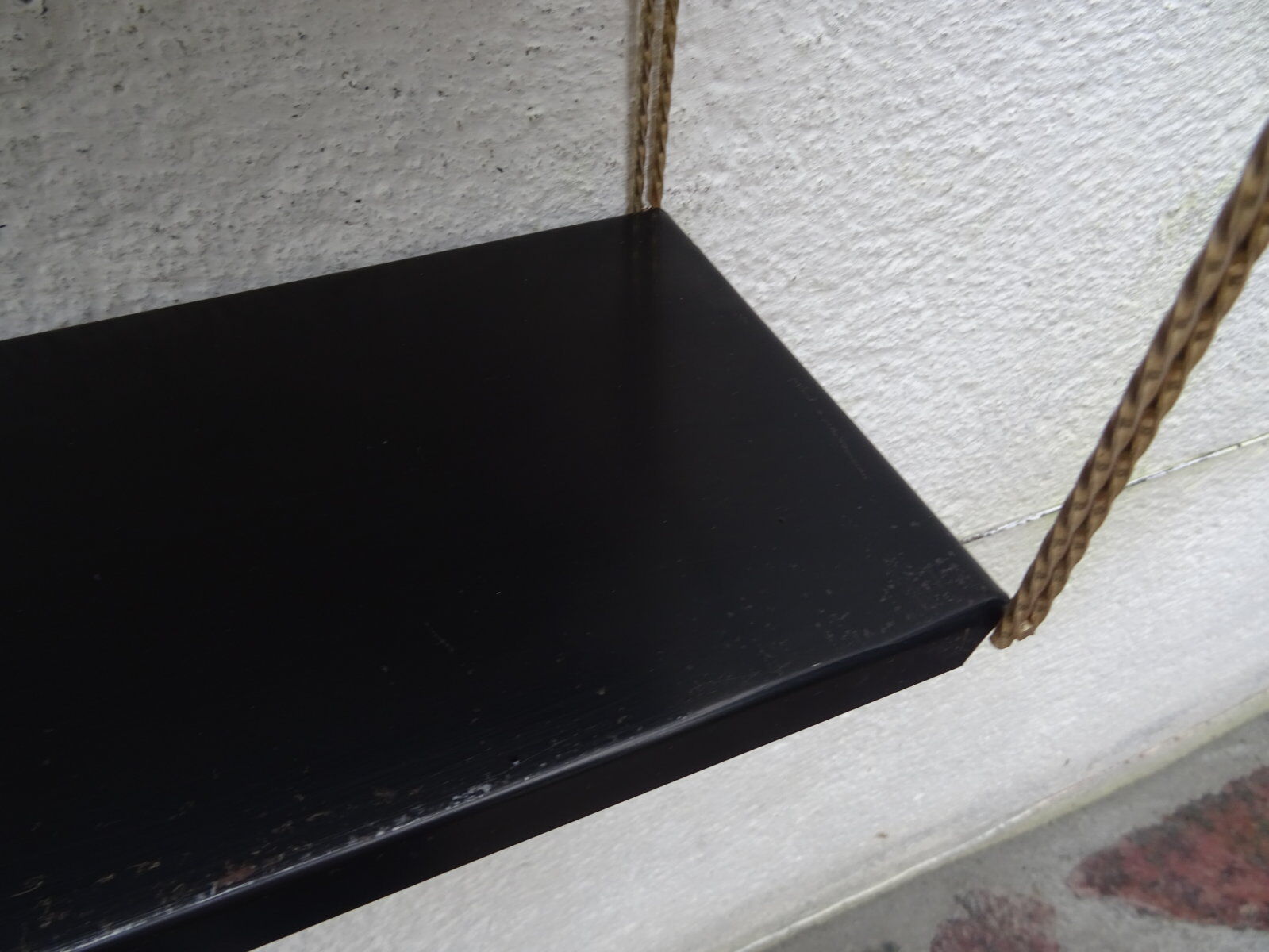 Metal thong wall shelf