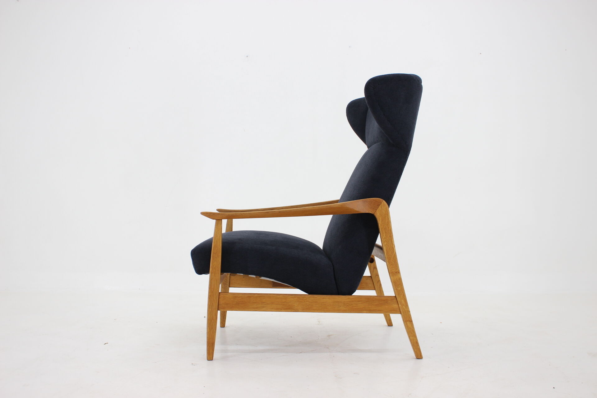 Oak reclining wing chair, czechoslovakia, 1960