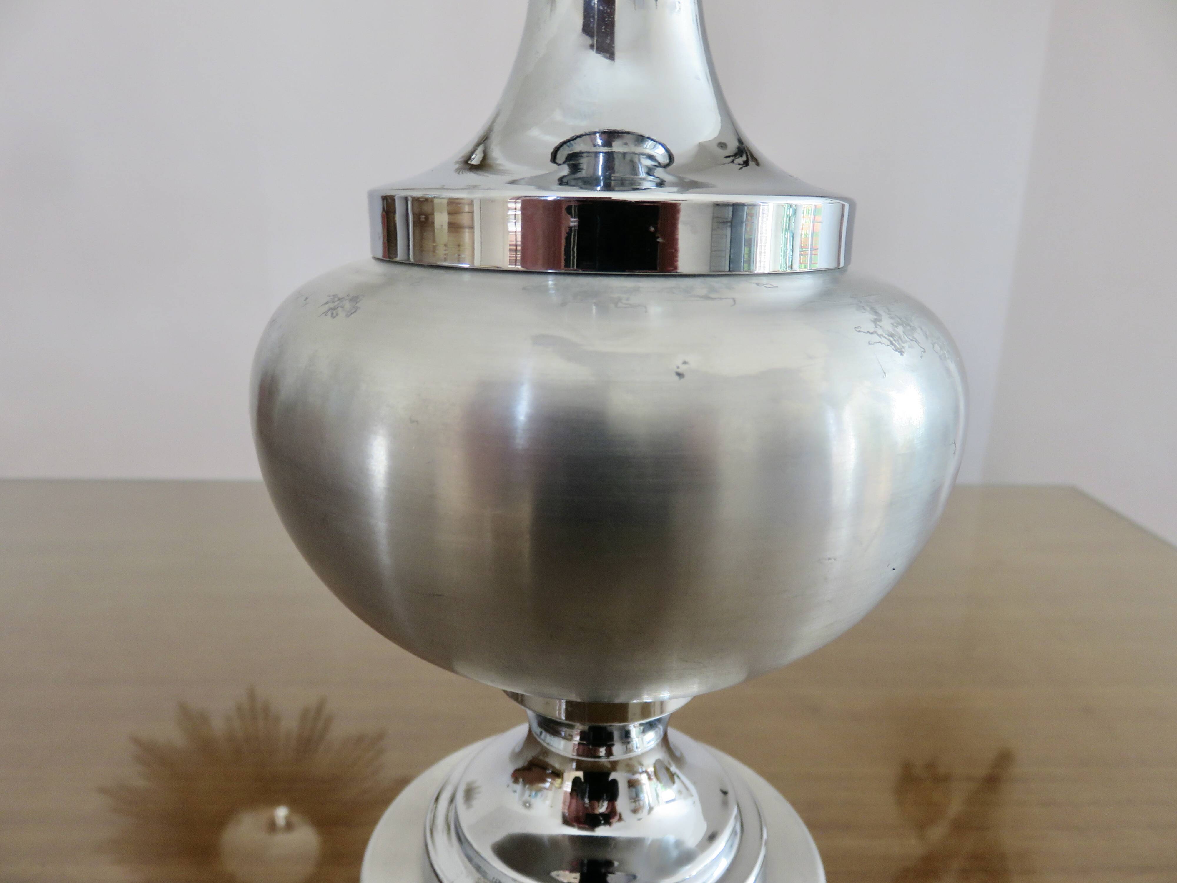 Brushed aluminum and chrome lamp typical of the 70s