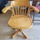 Wooden swivel armchair