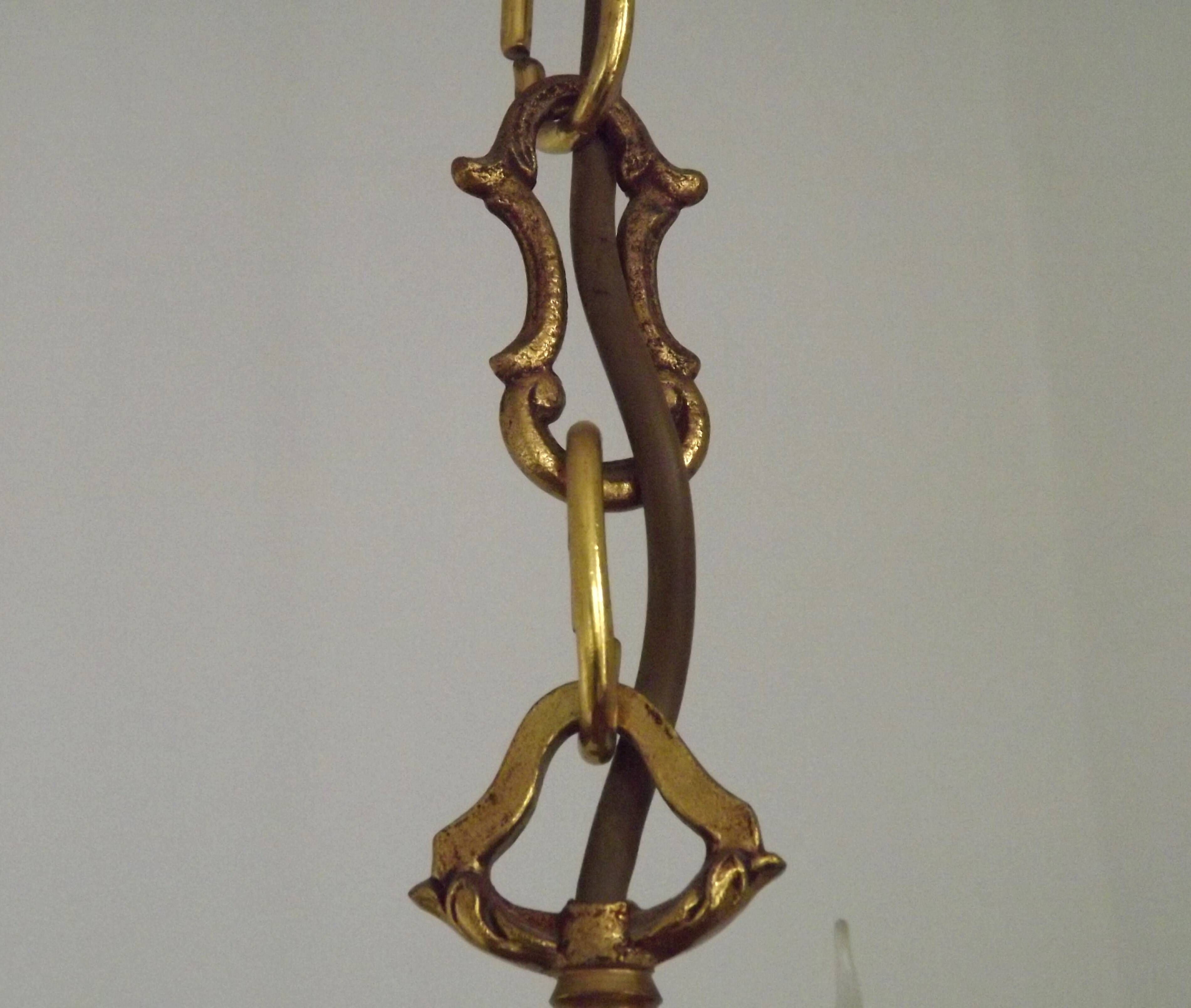 Vintage French traditional style bronze chandelier with 5 lights featuring acanthus leaf details.