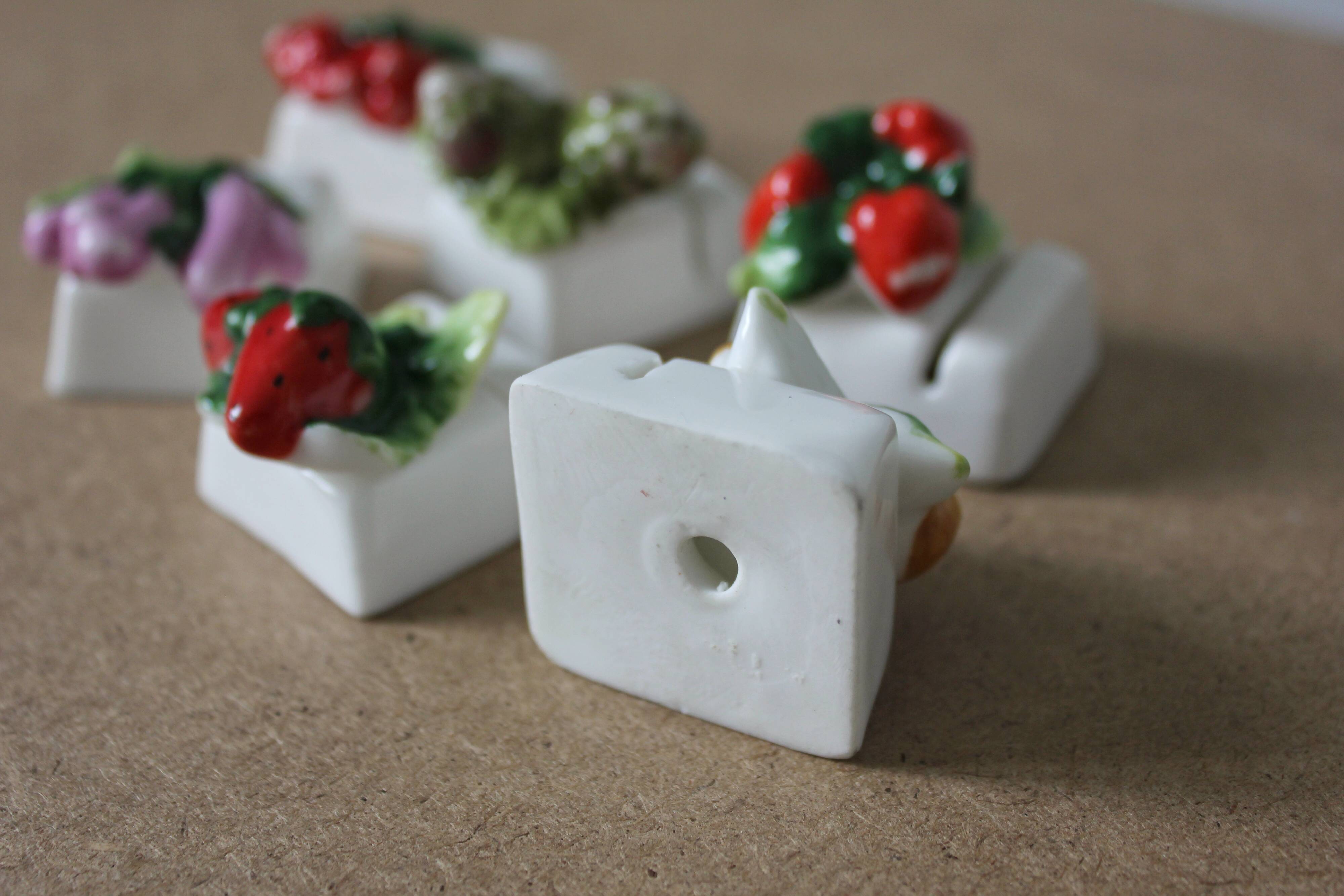 6 vintage fruit and vegetable-themed porcelain name tags in barbotine