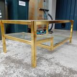 Glass and golden brass coffee table