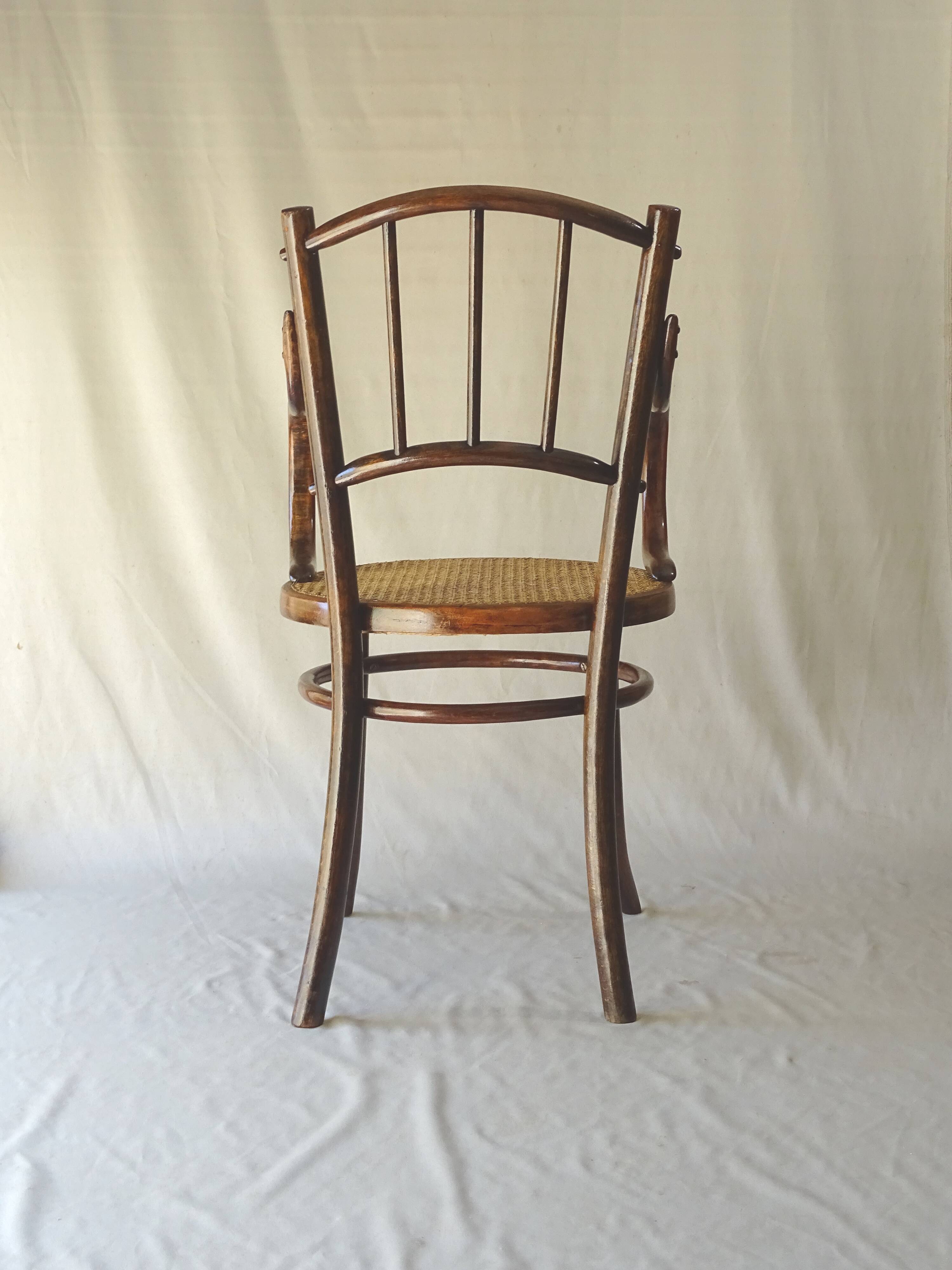 Small canned armchair; in curved wood, bistro, 1890