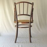 Small canned armchair; in curved wood, bistro, 1890