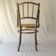 Small canned armchair; in curved wood, bistro, 1890