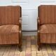 Pair of 1920s brown armchairs in carved wood and fabric, with caning detail.
