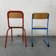 Set of 2 mismatched industrial school chairs