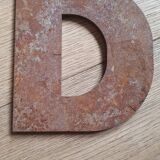 Metal letter D