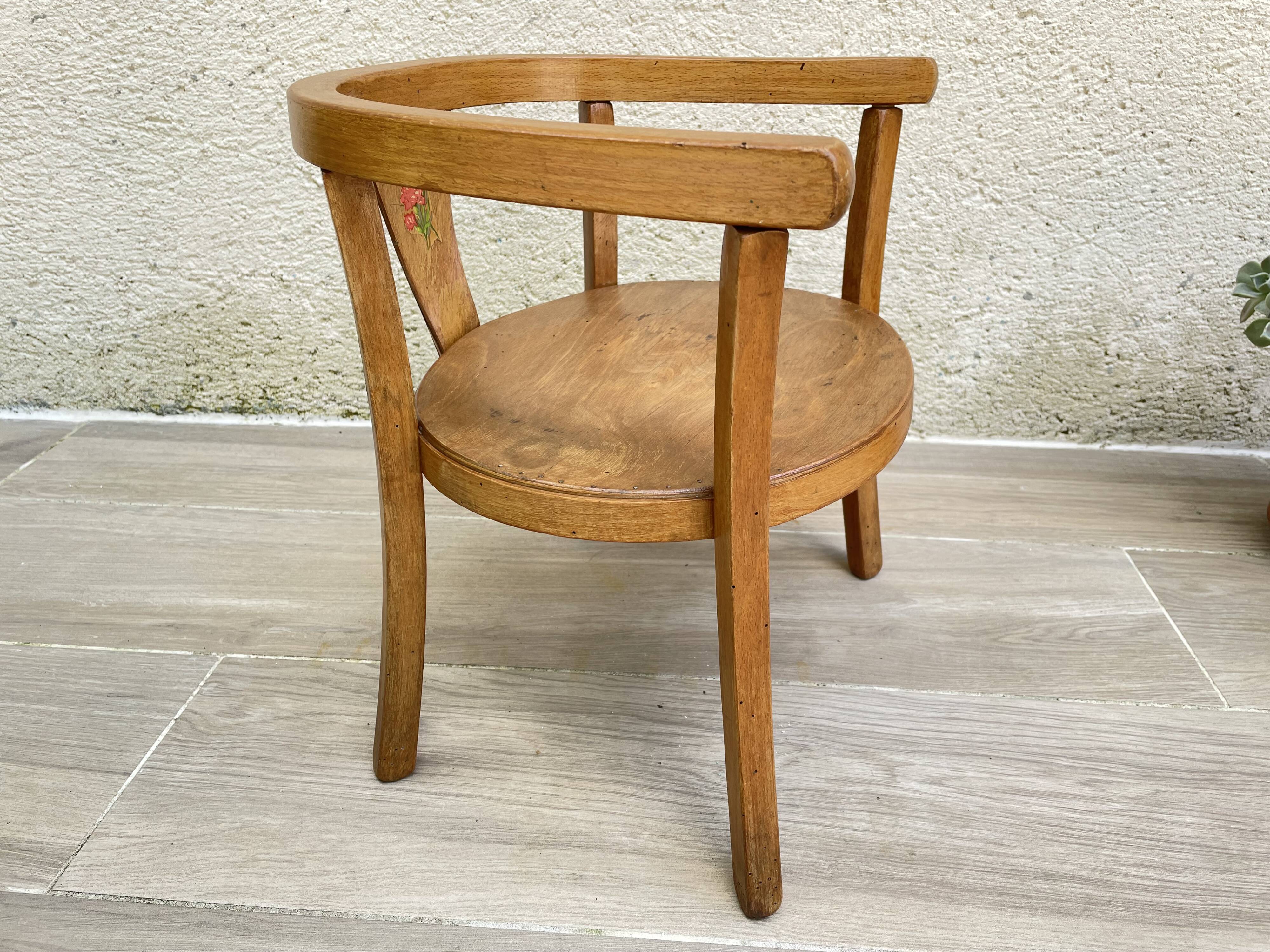 Old armchair for children in wood