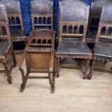 Set of 8 Renaissance style chairs in walnut and embossed leather