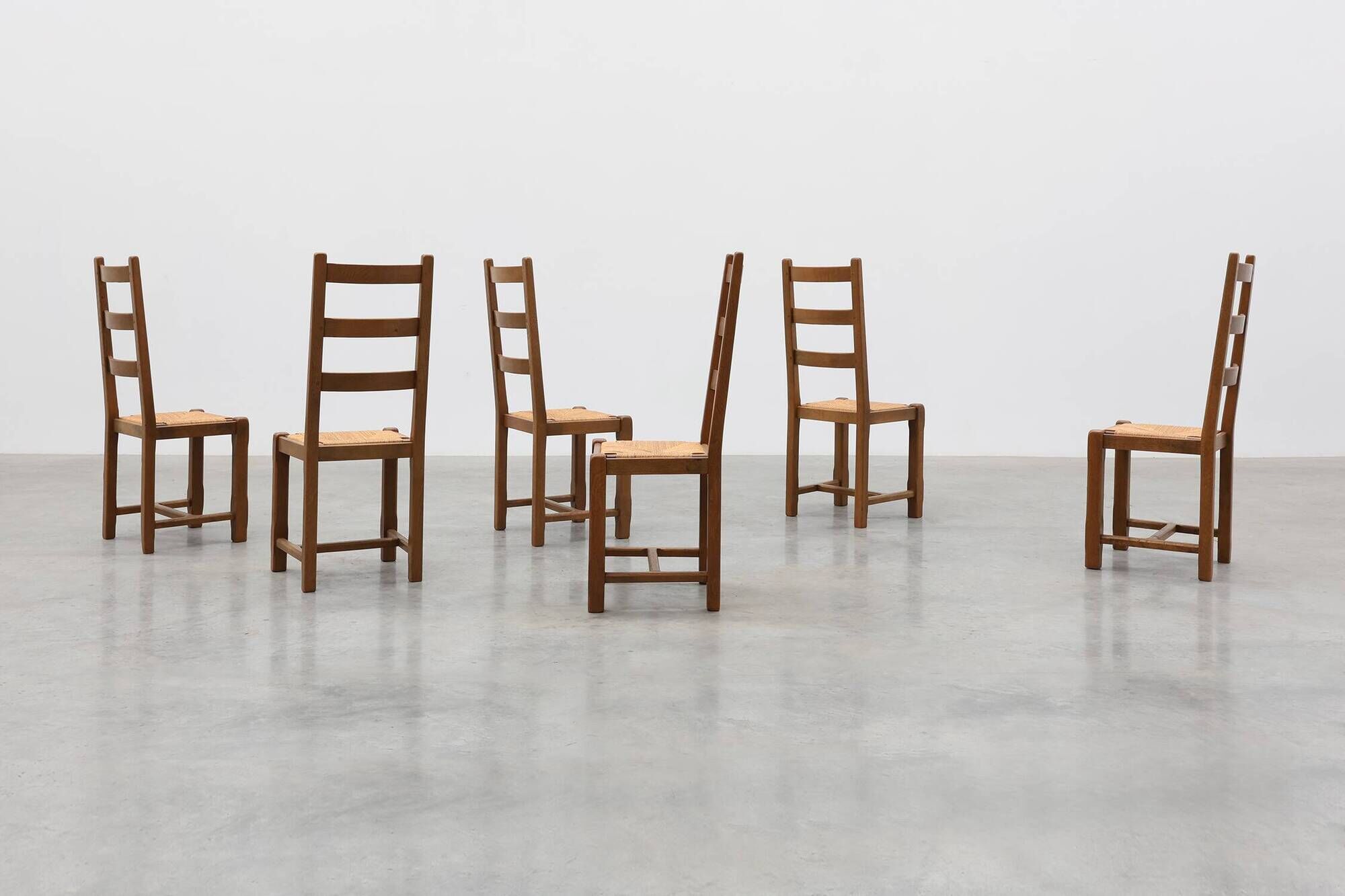 Set of 6 rustic oak ladder-back chairs with rush seats, France, 20th centur