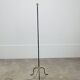 1950s tripod floor lamp, brass and black metal