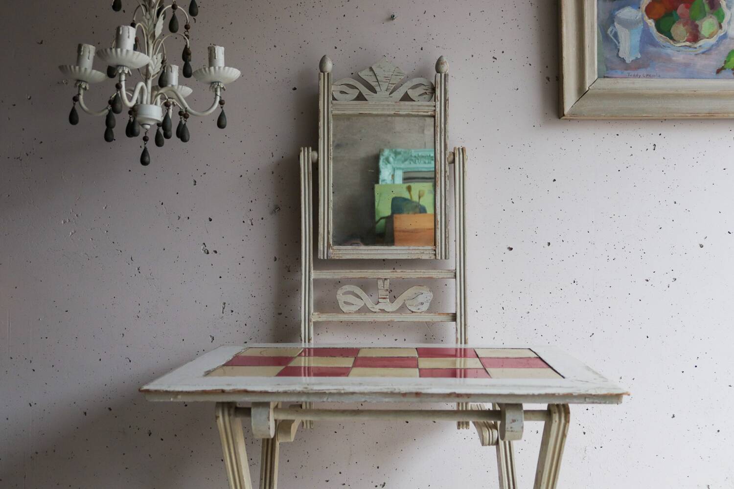 Small antique folding wooden dressing table with tiles and a mercury mirror.