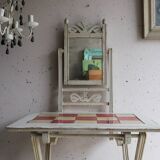 Small antique folding wooden dressing table with tiles and a mercury mirror.
