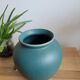 Almond-green ceramic round vase