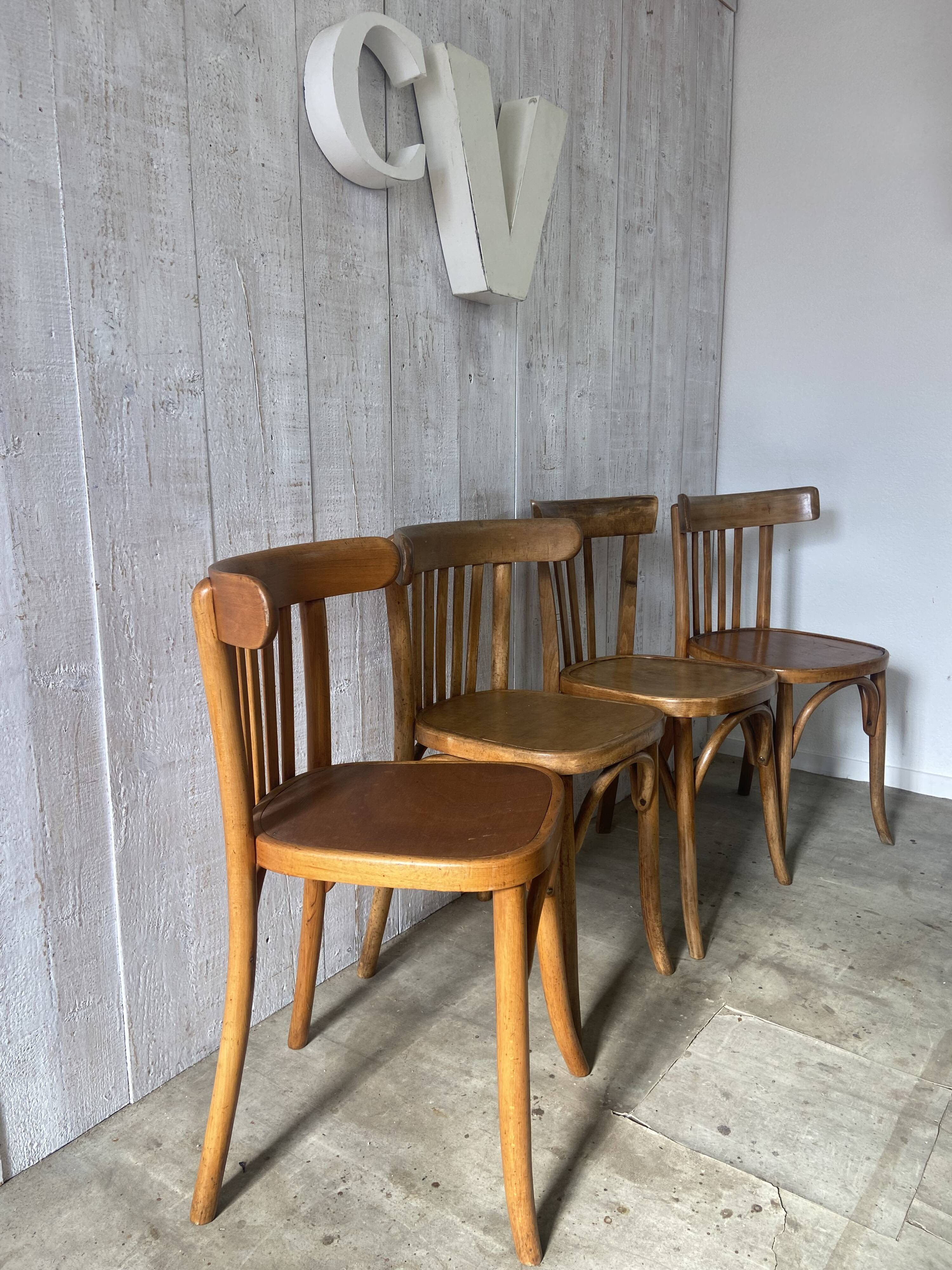 Mismatched curved wood bistro chairs (Fischel..)