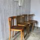 Mismatched curved wood bistro chairs (Fischel..)