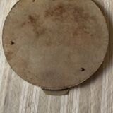 A large round mirror tray with metal handles