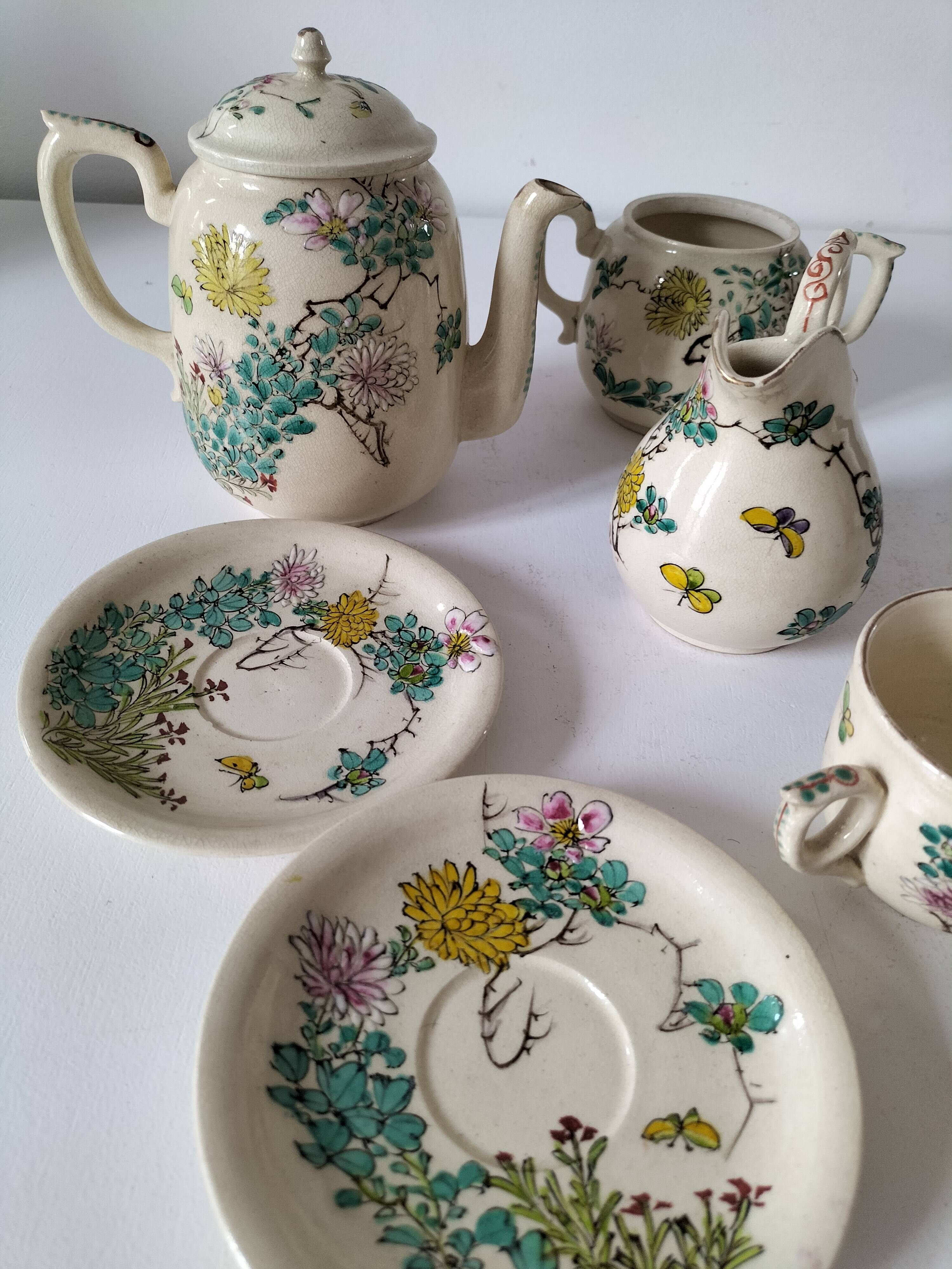 Japanese-style tea set in cracked earthenware with chrysanthemum flowers