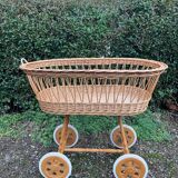 Vintage wicker cradle on casters