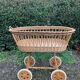 Vintage wicker cradle on casters